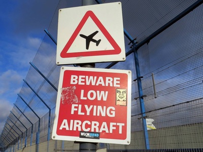 Beware low flying aircraft sign for London City Airport in Newham, E16