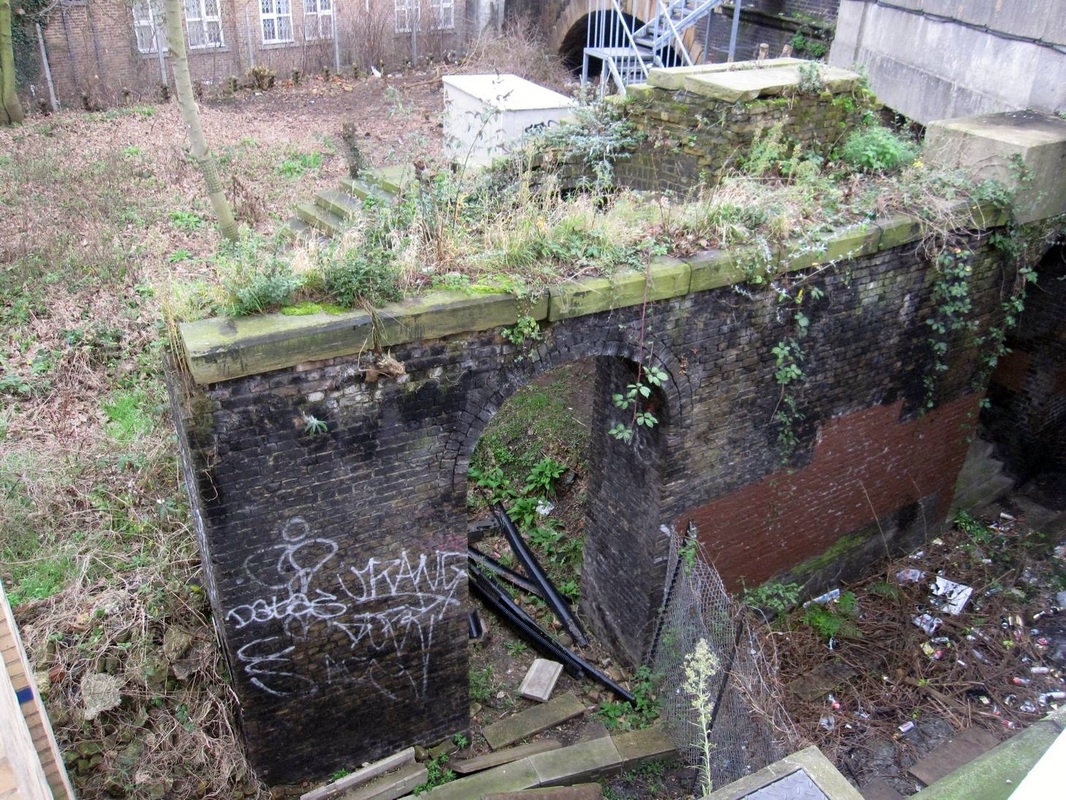  Derelict remains of a lost London canal - the original Kensington Canal bridge at West Brompton Station station