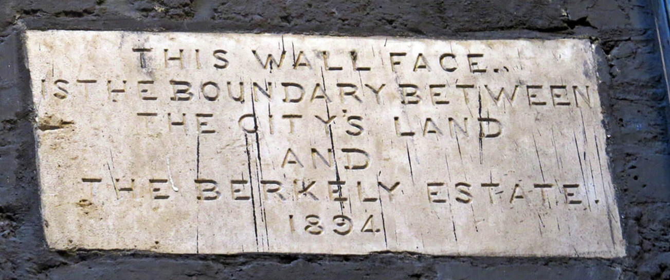 plaque on Bruton Lane, Mayfair along the route of the River Tyburn giving notice that this wall face is the boundary between the City's land and the Berkeley Estate