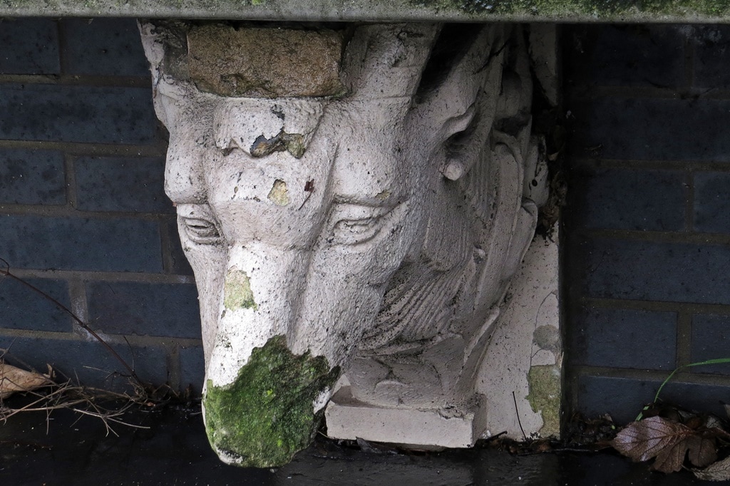 goat heads from the old pub at Goat Bridge in South Norwood now are part of a bench outside flats on the original site