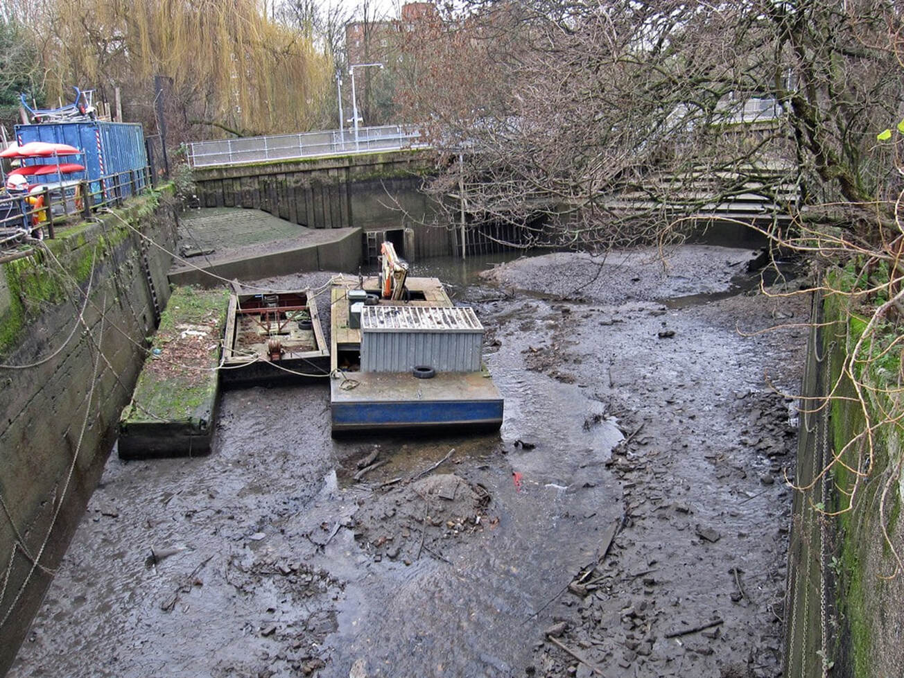 Picture of the mouth of the Beverley Brook. Sluice gates provide a flood defence from the Thames near Putney Bridge