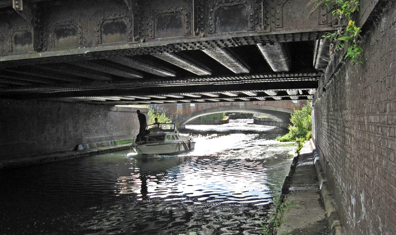 Picture of Thames tributary River Ember below the railway bridge and Hampton Court Way (A309) bridge 
