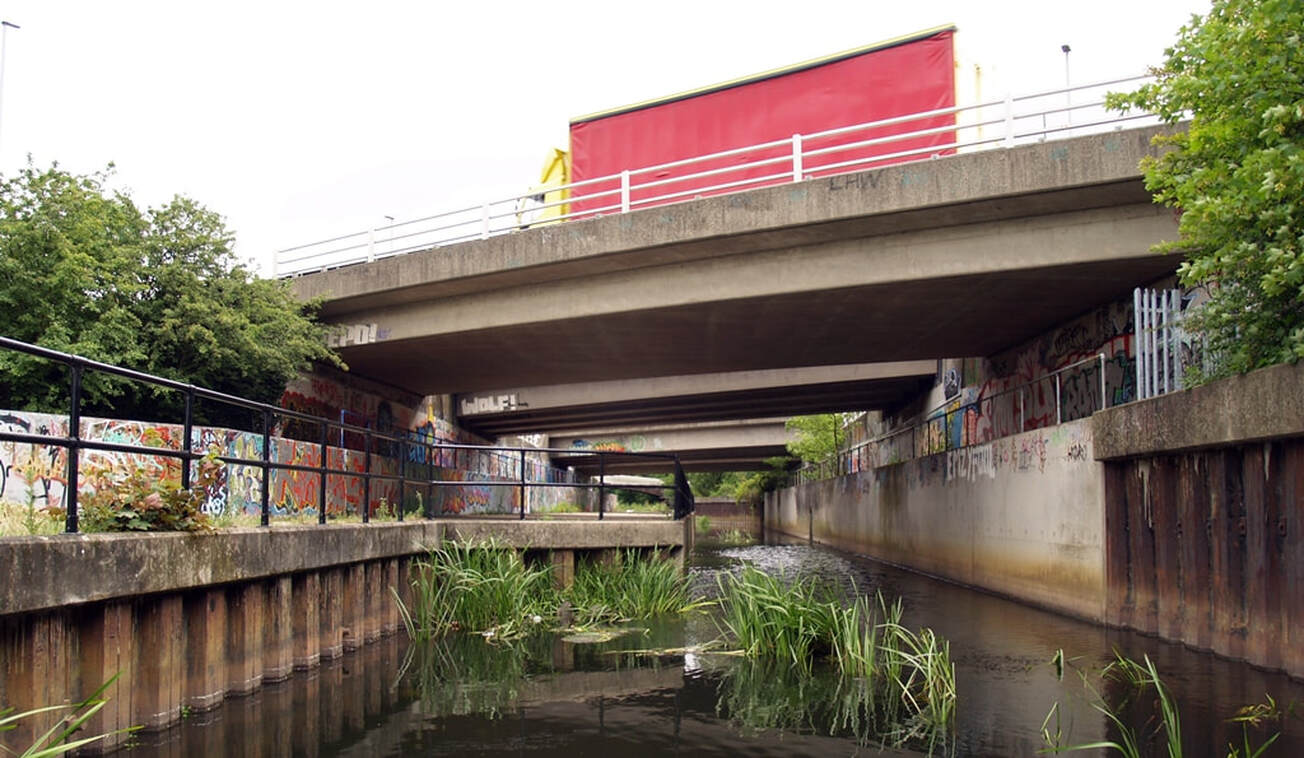 Picture of concrete dual carriageway  flyover of the  A406 (North Circular) crosses the River Roding in Redbridge