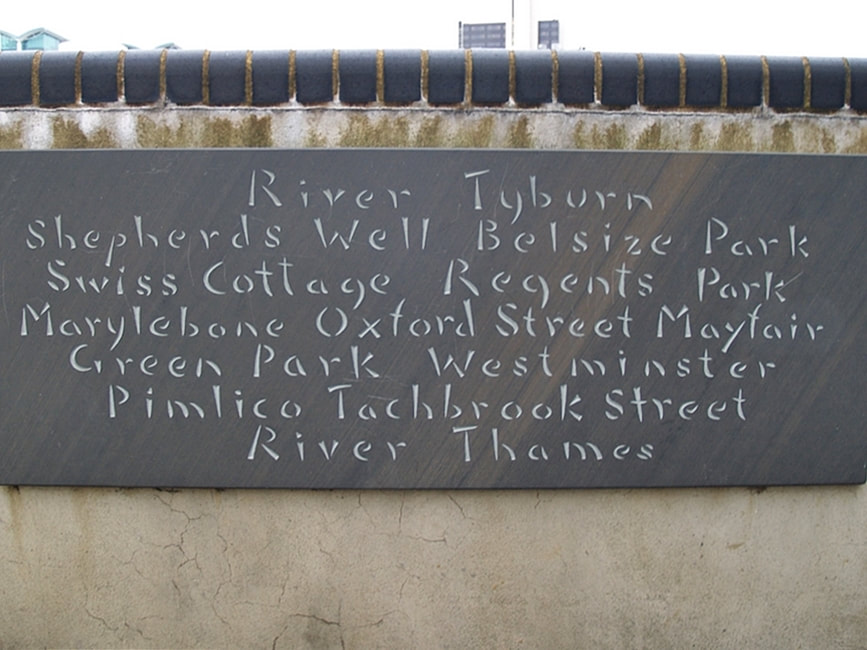 Tablet beside the River Thames in Pimlico describing place names on the route of the River Tyburn. Shepherds Well, Belsize Park, Swiss Cottage, Regents Park, Marylebone, Oxford Street, Mayfair, Green Park, Westminster, Pimlico, Tachbrook Street.